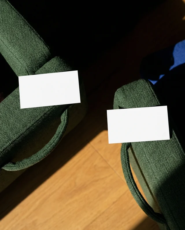 Elegant Business Card Mockup on Green Armchairs
