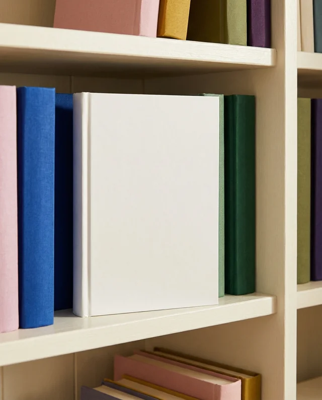 Colorful Book Mockup on a Cozy Bookshelf