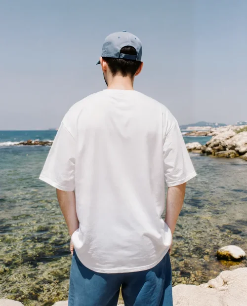 Mockup of Young Man in T-Shirt by the Coast