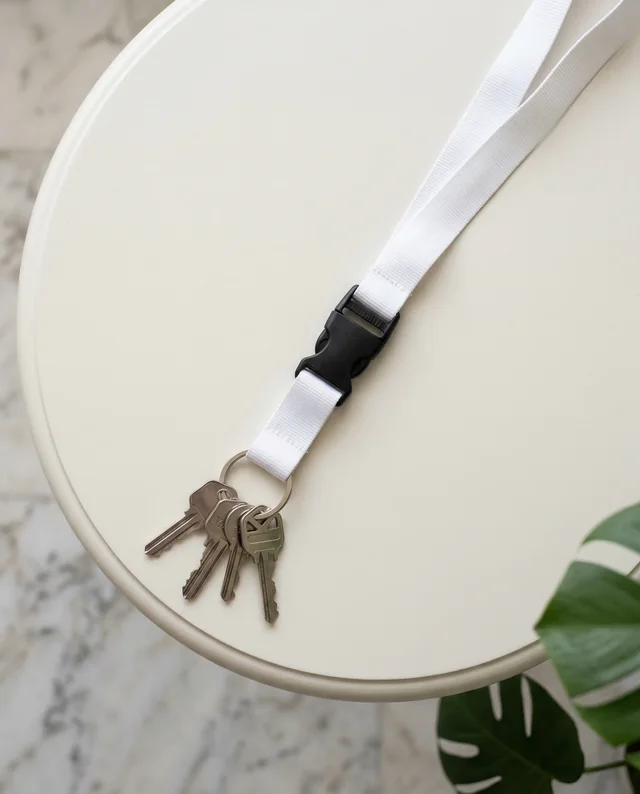 Modern Lanyard Mockup with Silver Keys on Light Table
