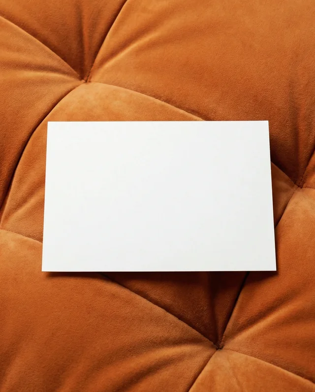 Elegant Mockup of a Flyer on Plush Orange Velvet Surface