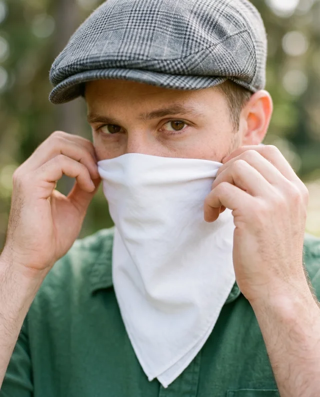 Young Man in Nature Adjusting a Stylish Bandana Mockup