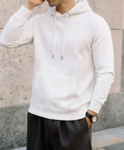 Stylish Hoodie Mockup of a Young Man Against Textured Wall