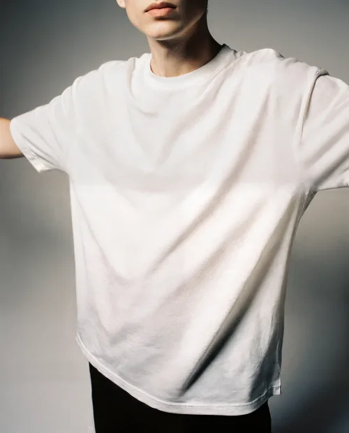 Mockup of T-Shirt on Young Male Model in Relaxed Style