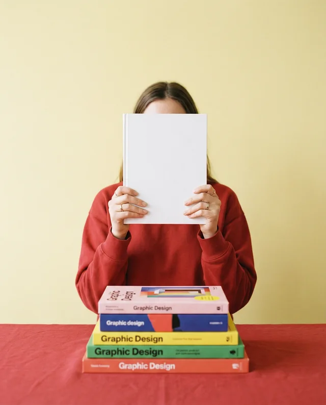 Cozy Mockup of a Person with a Book in Warm Setting