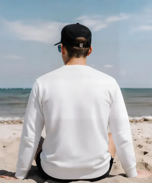 Relaxing Mockup of Young Man in Sweatshirt on Beach