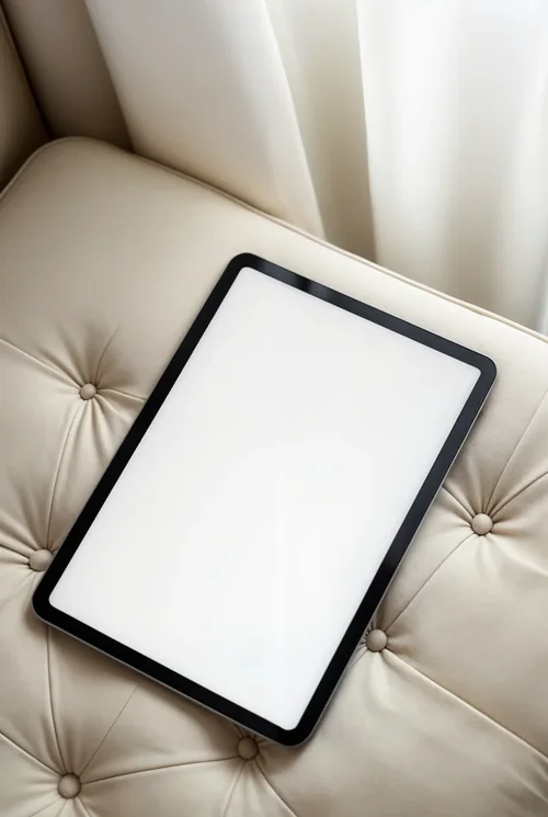 Black iPad Pro Mockup on Quilted Couch - Minimalist Style