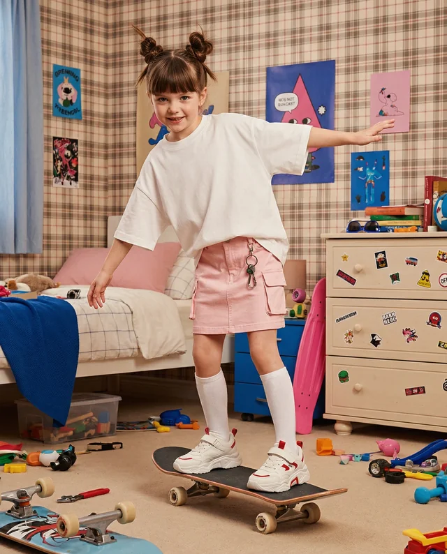 Cheerful T-Shirt Mockup for Young Skateboarder