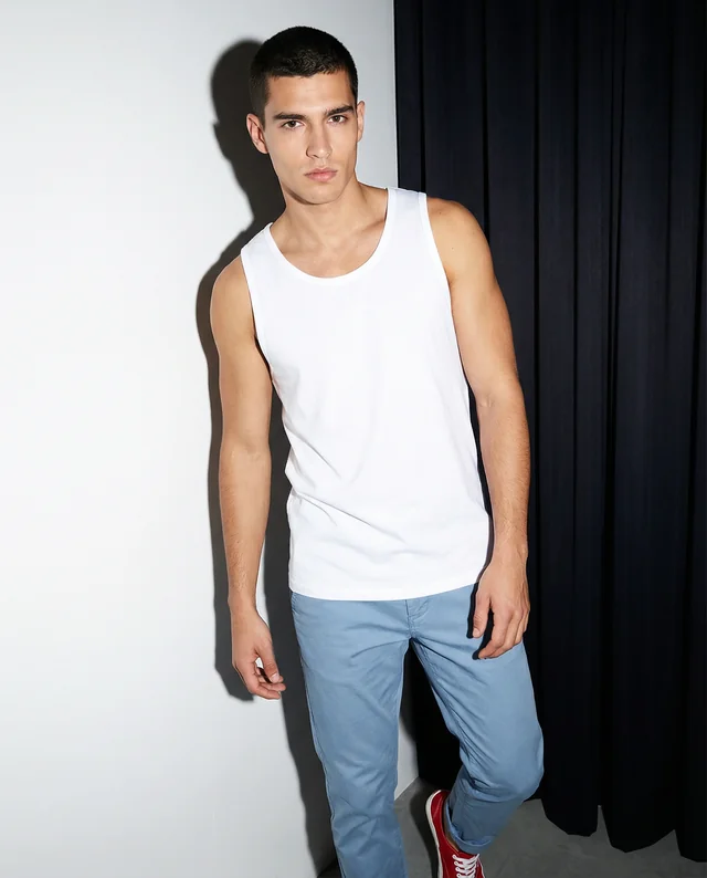 Stylish Male Model in White Tank Top Mockup in Studio