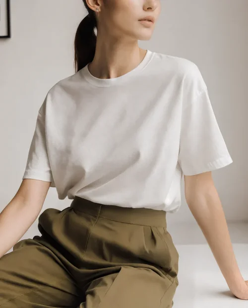 Elegant T-Shirt Mockup of a Young Woman in Natural Light