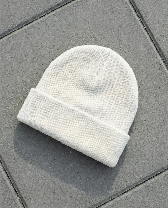 Cozy White Knit Beanie Mockup on Gray Pavement