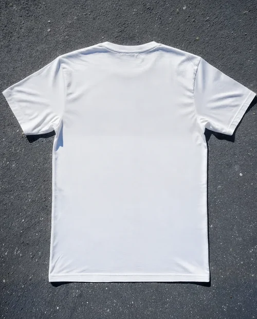 Mockup of a Plain White T-Shirt on Asphalt Surface