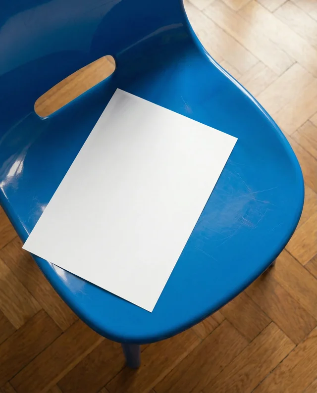 Vibrant Mockup of Poster with Blue Chair and Paper