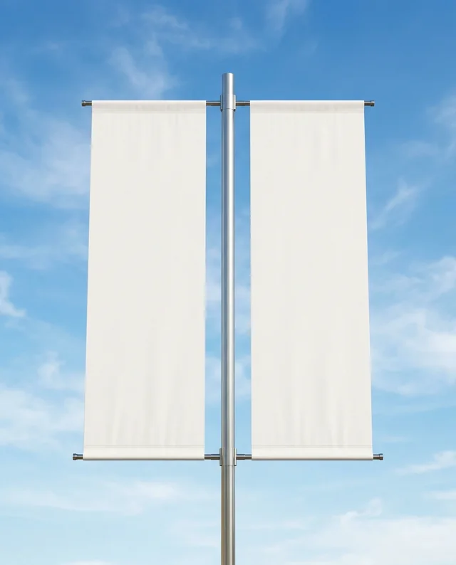 Blank Vertical Banner Mockup Against Clear Blue Sky
