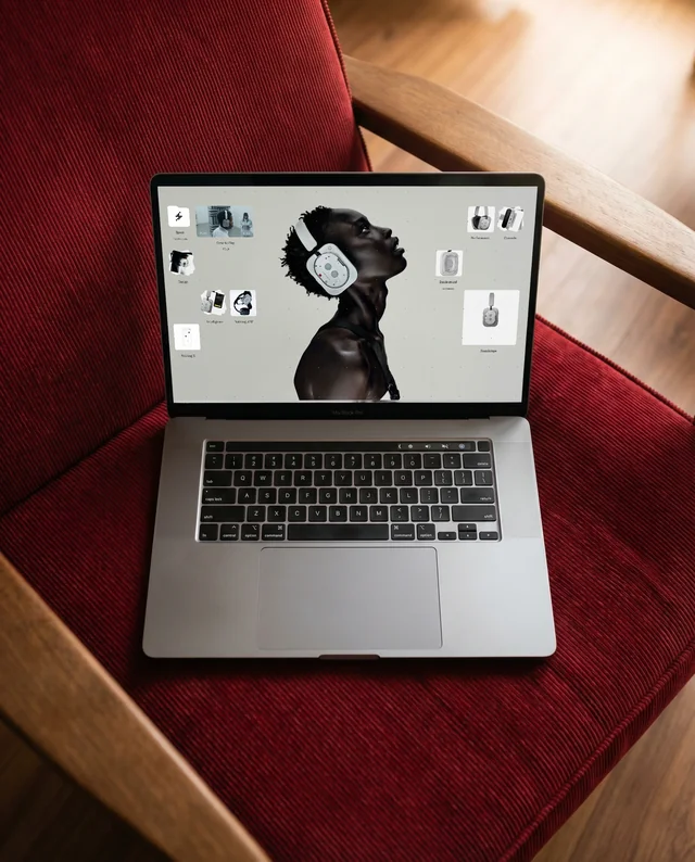 Elegant MacBook Mockup on Cozy Armchair