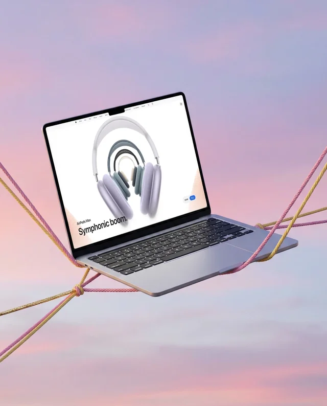 Sleek MacBook Mockup in Mid-Air with Colorful Ropes