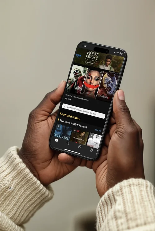 Black iPhone 16 Pro Max Mockup in Hands of Young Adult