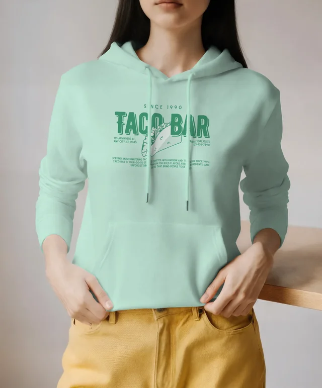 Stylish Hoodie Mockup Featuring Young Woman in Minimalist Setting