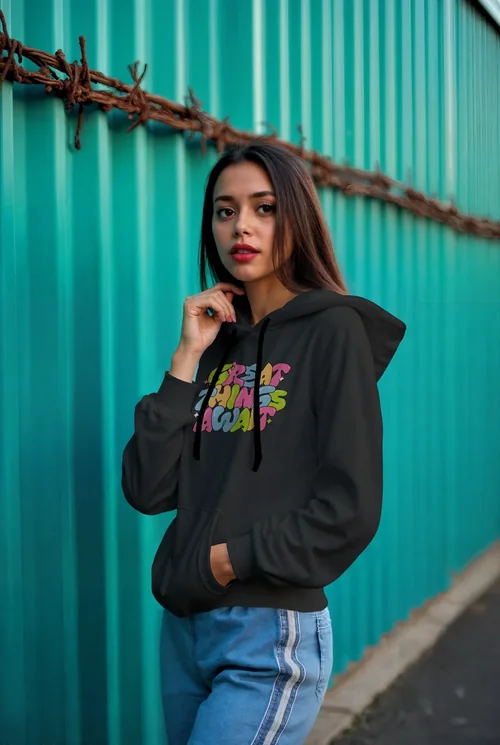 Vibrant Teal Background Mockup of a Hoodie in Urban Scene