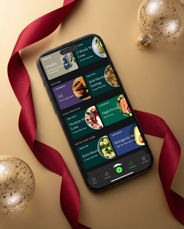 Elegant iPhone Mockup on Warm Gold Surface