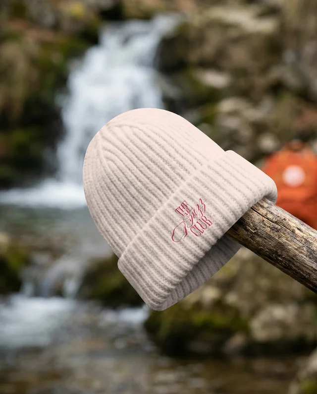 Cozy Cream Beanie Mockup by a Serene Waterfall