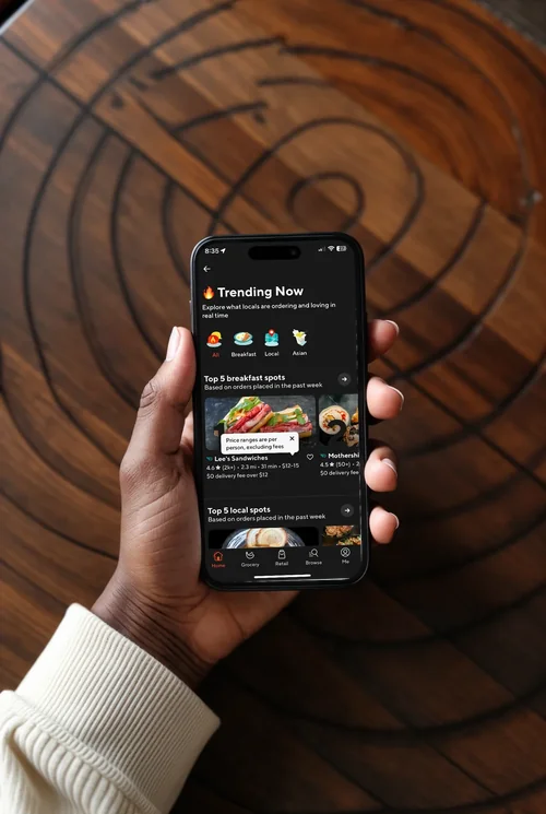 Mockup of iPhone 16 Pro Max on Wooden Table - Minimalist