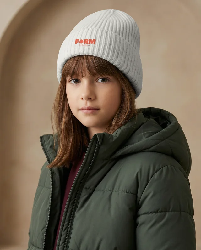 Cozy Beanie Mockup Featuring Young Girl in Puffer Jacket