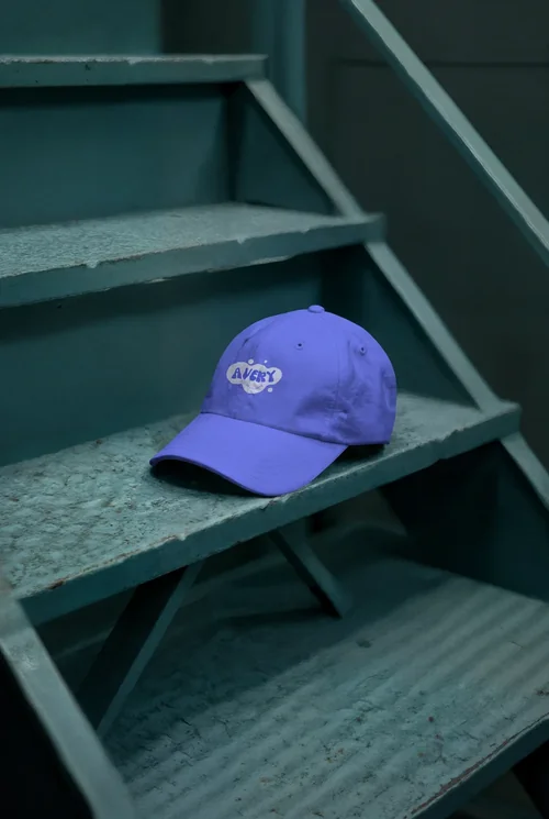 Stylish Mockup of a Hat on Weathered Teal Stairs