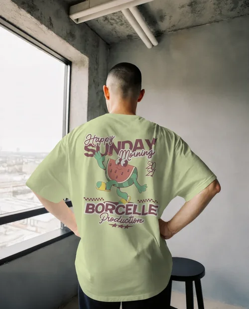 Mockup of a Person in Oversized T-Shirt by Window
