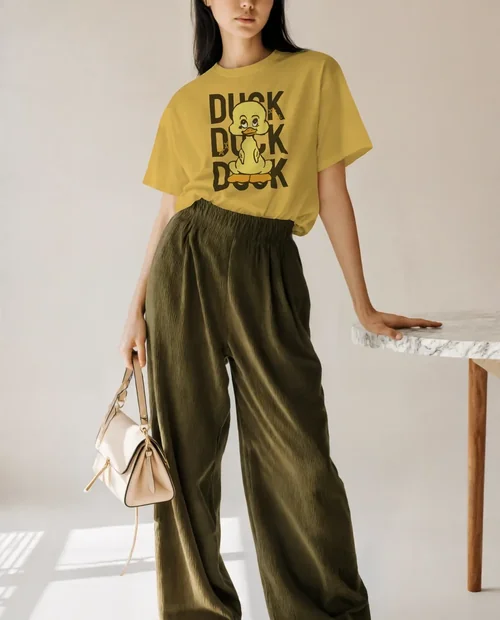 Chic T-Shirt Mockup Featuring Confident Young Woman