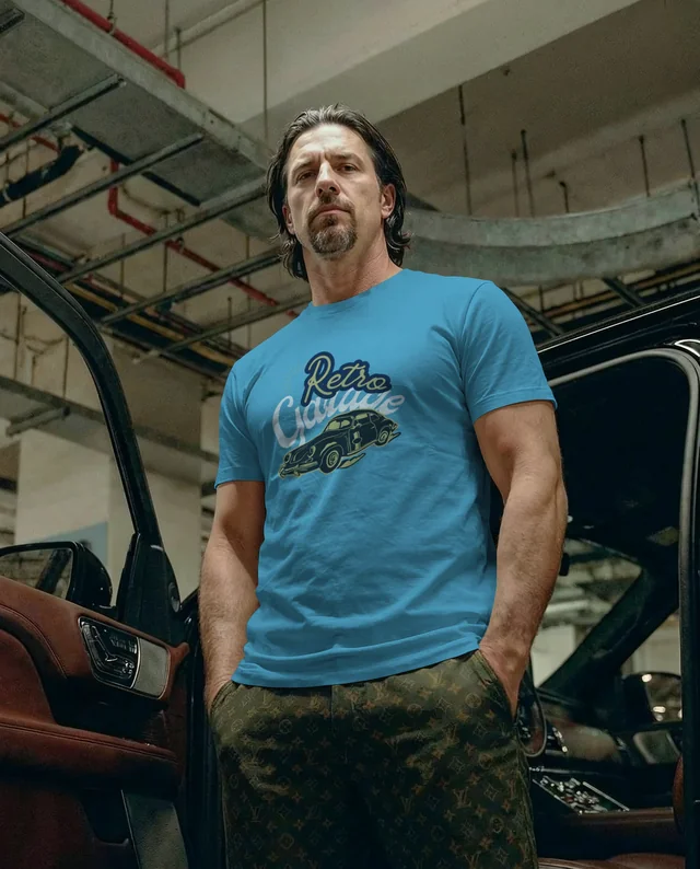 Stylish T-Shirt Mockup with Confident Man in Garage