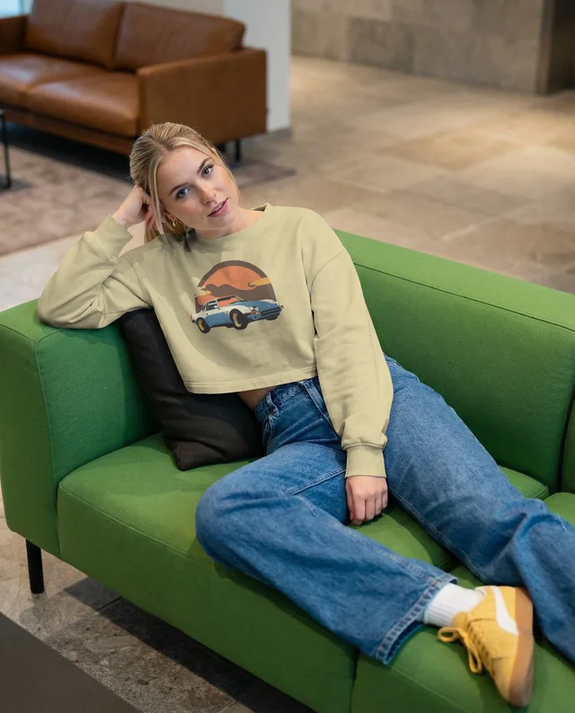 Stylish Mockup of a Woman in a Crop Top on Sofa