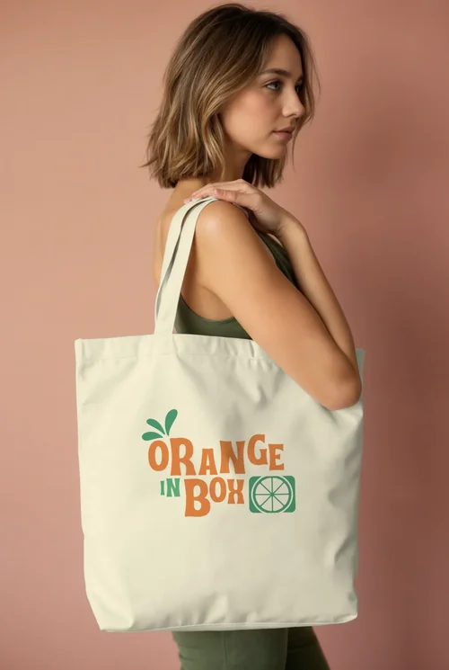 Mockup of a Minimalist Tote Bag with Woman Model