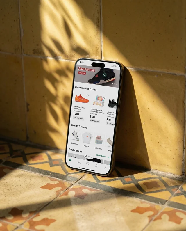 Modern iPhone Mockup Against Textured Yellow Wall