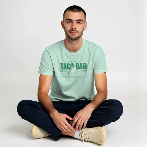 Mockup of Young Man in Light Pink T-Shirt on Soft Background