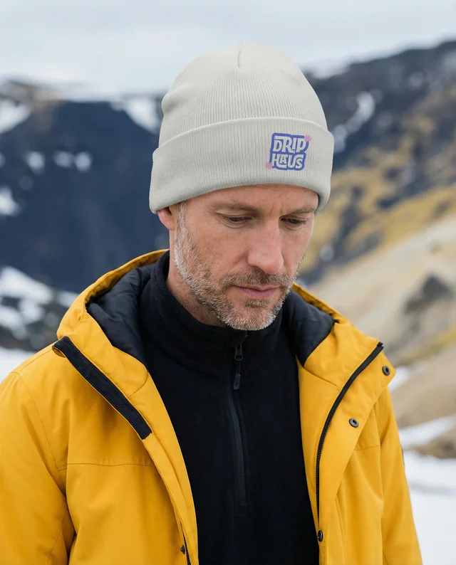 Contemplative Man in Beanie and Waterproof Jacket Mockup
