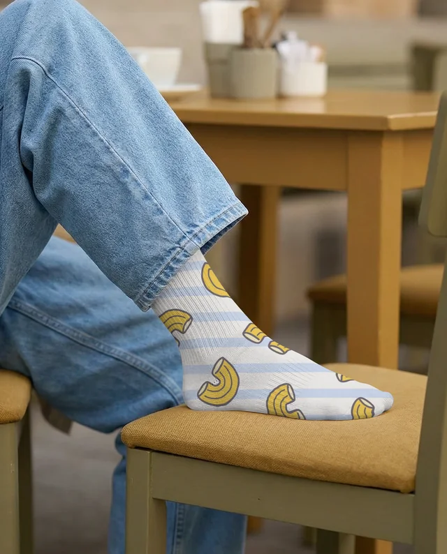 Cozy Café Mockup Featuring Relaxed Socks and Denim