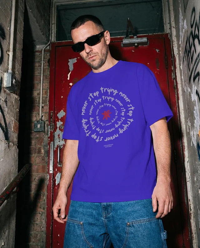 Urban T-Shirt Mockup Featuring Confident Male Model