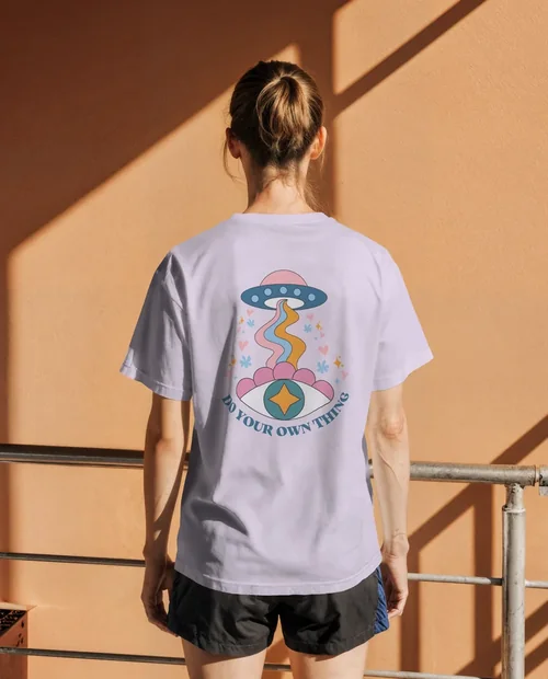 Casual T-Shirt Mockup Against Warm Peach Wall