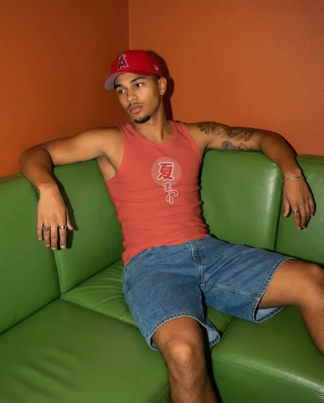 Casual Mockup of a Young Man in a Tank Top on Couch