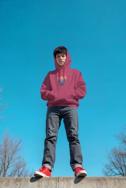Vibrant Hoodie Mockup Against Clear Blue Sky and Trees