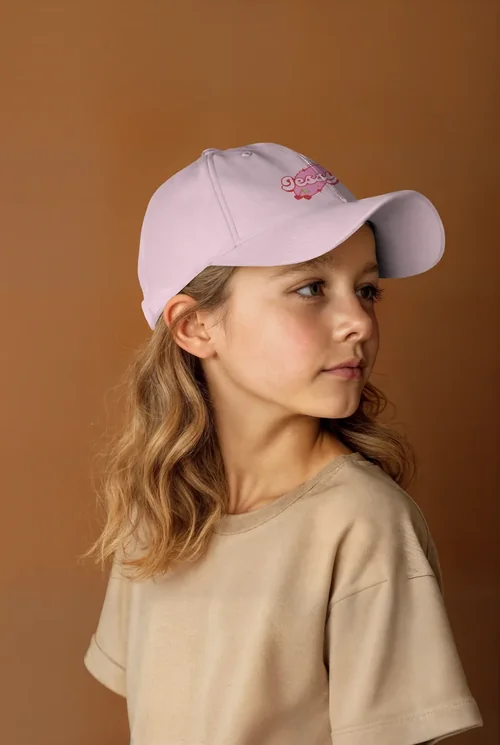 Stylish Hat Mockup Featuring a Thoughtful Young Girl