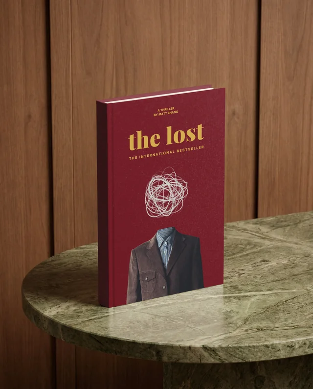 Elegant Mockup of a Blank Book on Marble Table