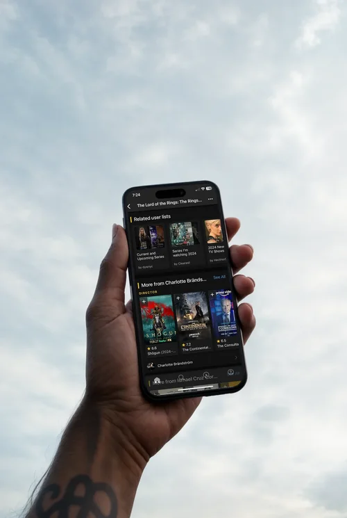 Black iPhone 16 Pro Max Mockup Against Cloudy Sky