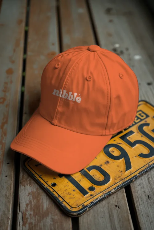 Mockup of a Classic White Hat on Rustic Wood Surface
