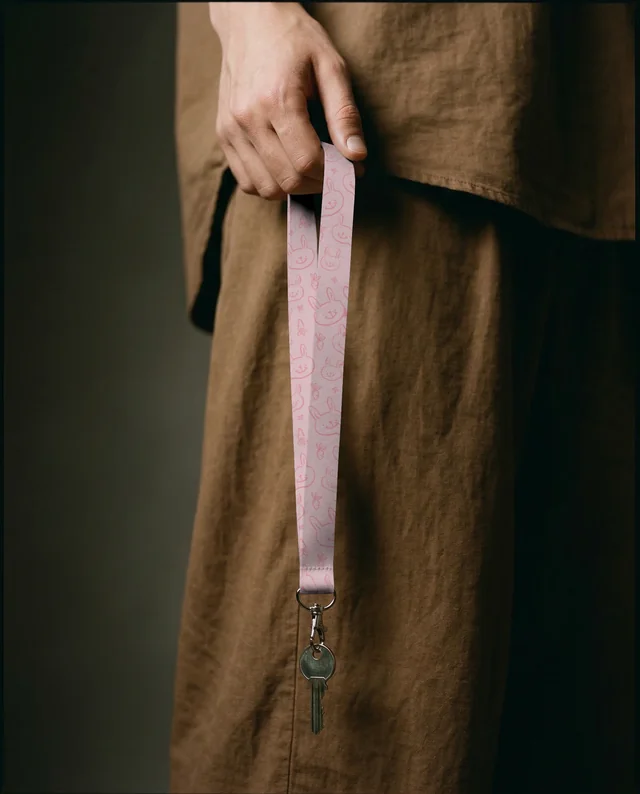 Elegant Mockup of a White Lanyard with Keys in Hand
