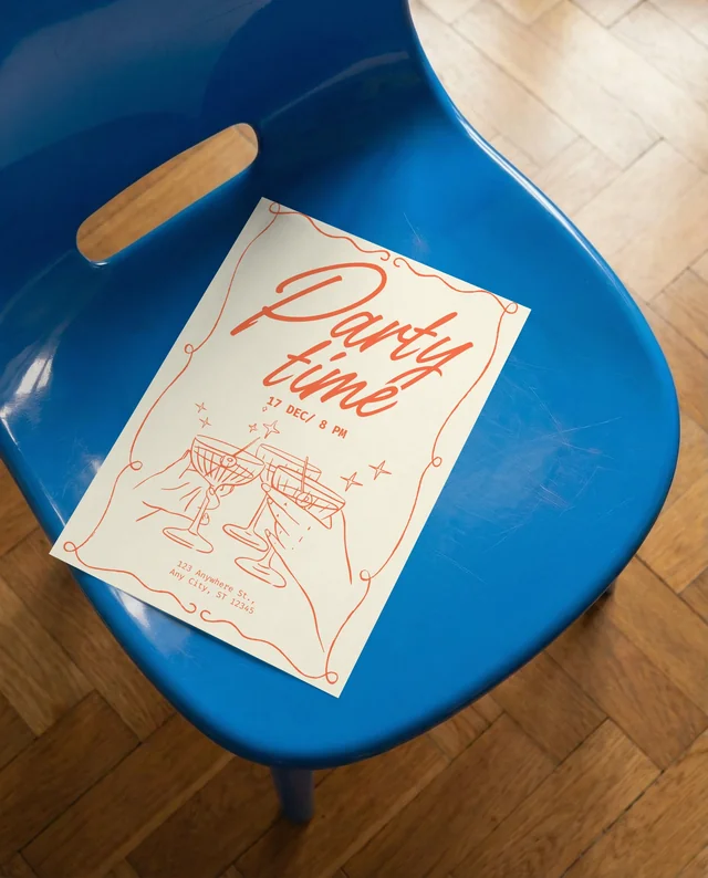 Vibrant Mockup of Poster with Blue Chair and Paper
